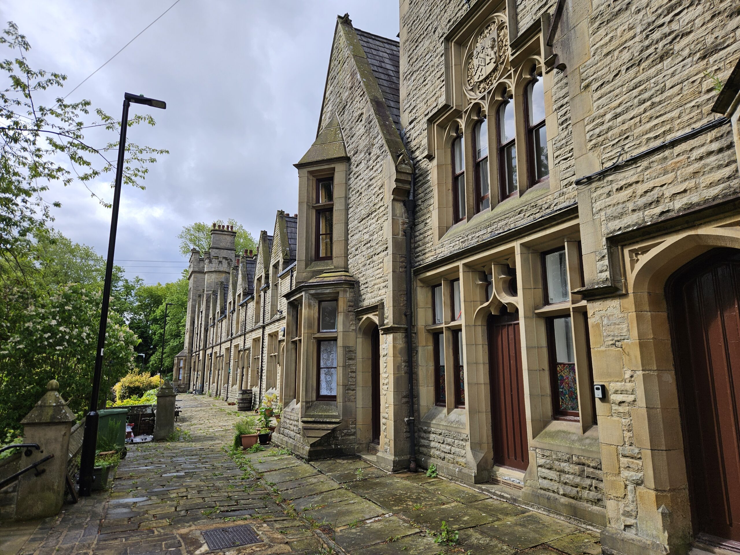 Sir Francis Crossley Almshouses Halifax, Grade I listed Victorian almshouses where HSG Surveys carried out an asbestos management survey in 2024 for Abbeyfield The Dales Ltd with annual reinspection since